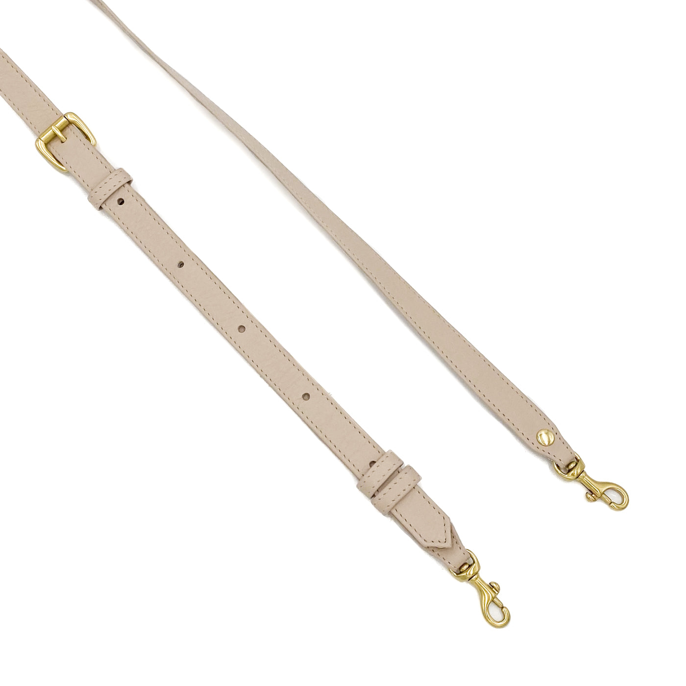 Leather adjustable crossbody strap in the color light pink with gold hardware