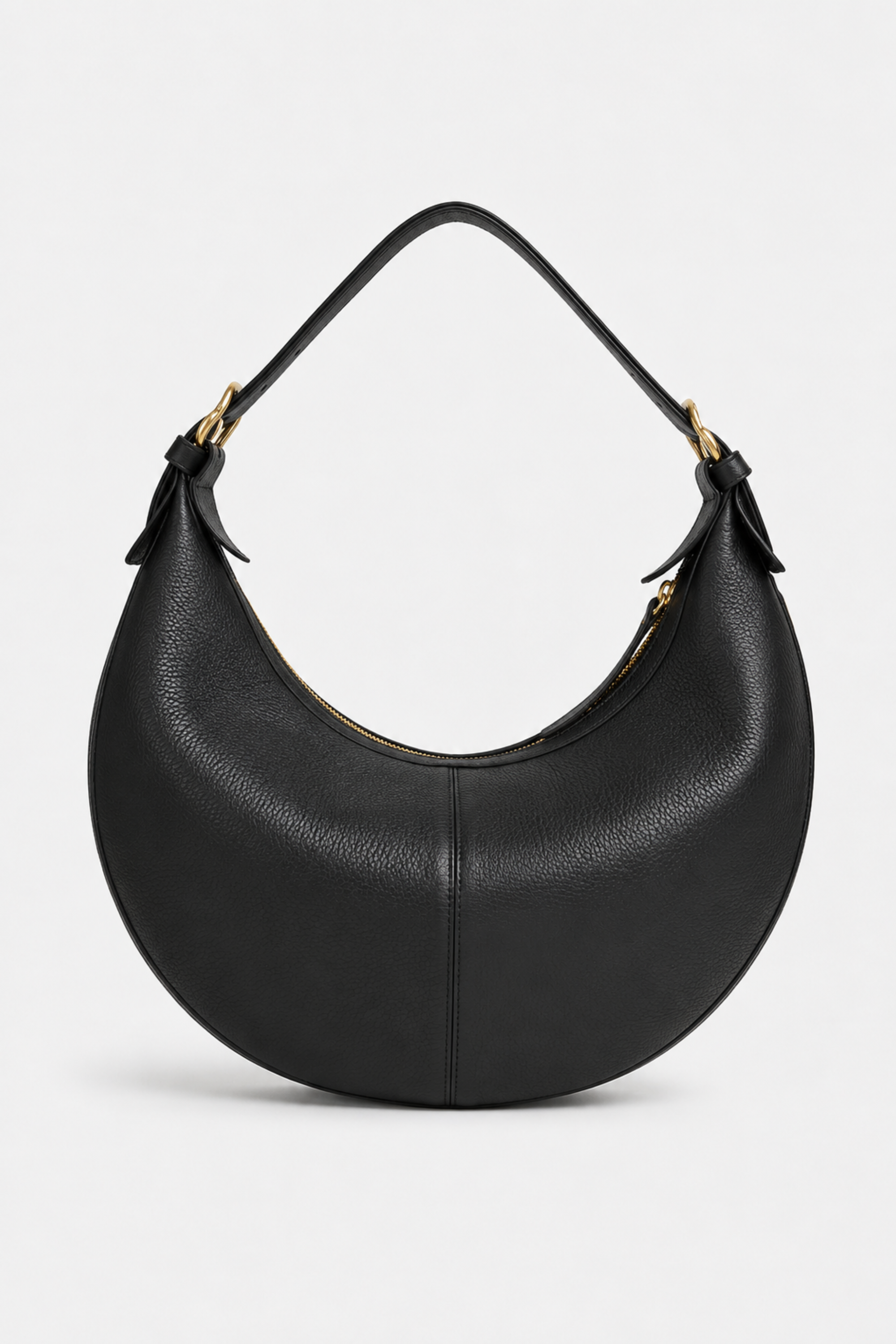 A black pebbled leather crescent-shaped shoulder bag with gold-tone hardware and an adjustable strap