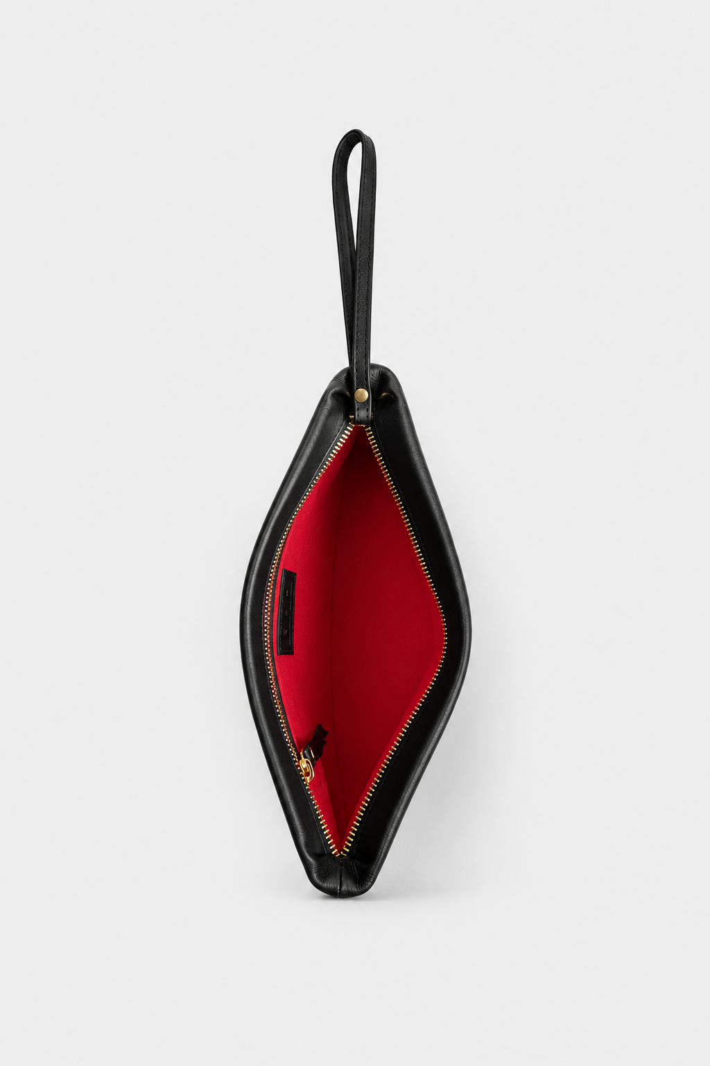 A black leather clutch pouch with a red interior lining, shown open with a wristlet handle and interior zipper pocket