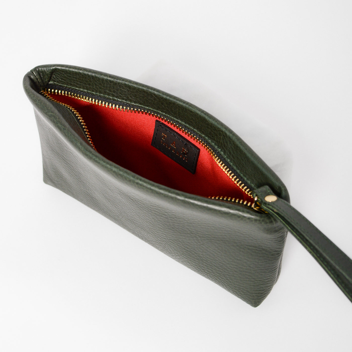 Bella Mini Wristlet in the color forest green, zipper closure, showing from the top view