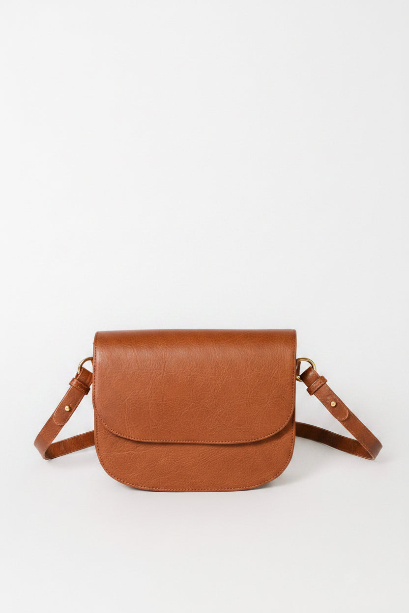 Handcrafted Leather Saddle bag in a light brown, flap closure with shoulder strap. 