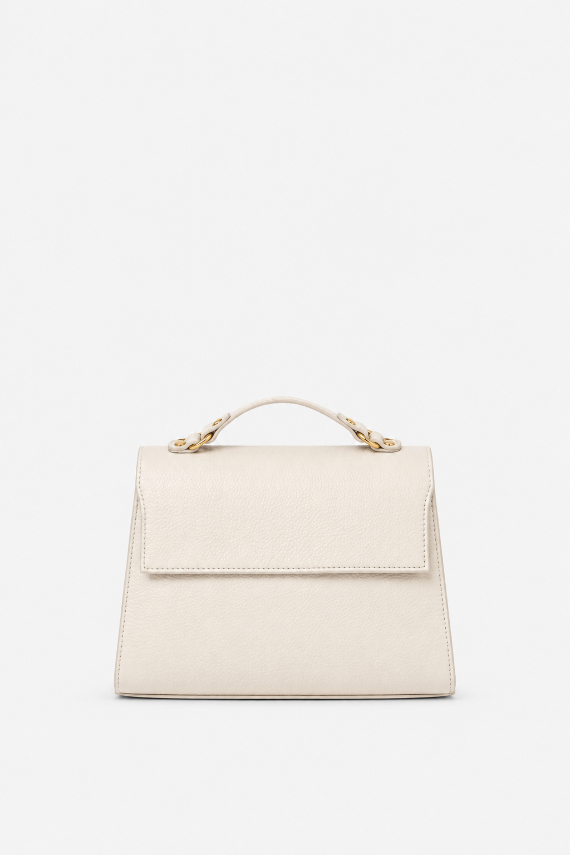 A structured top-handle handbag in a light cream or off-white color, featuring a flap closure and gold-tone hardware