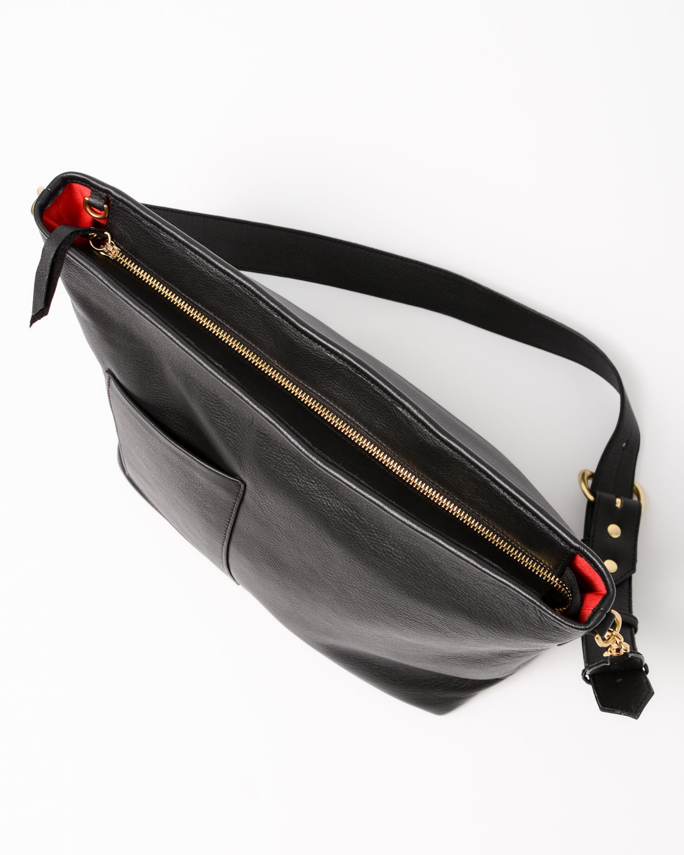 Black leather bag with gold zipper and red interior.