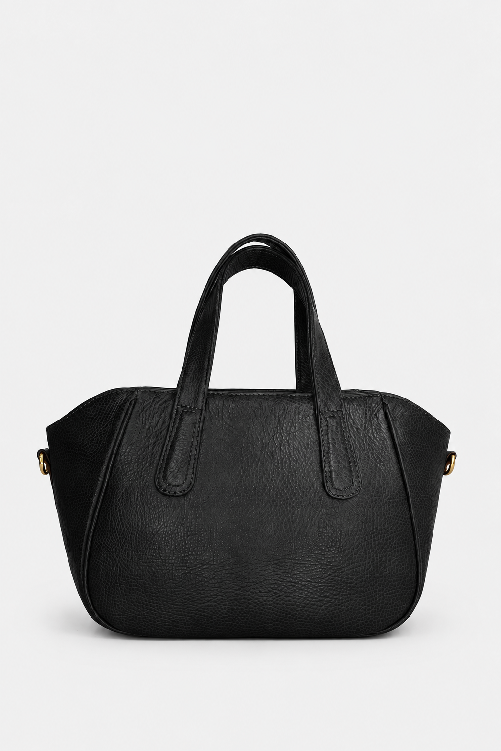 A black pebbled leather handbag with double top handles and small gold-tone hardware, photographed against a clean light gray studio background.