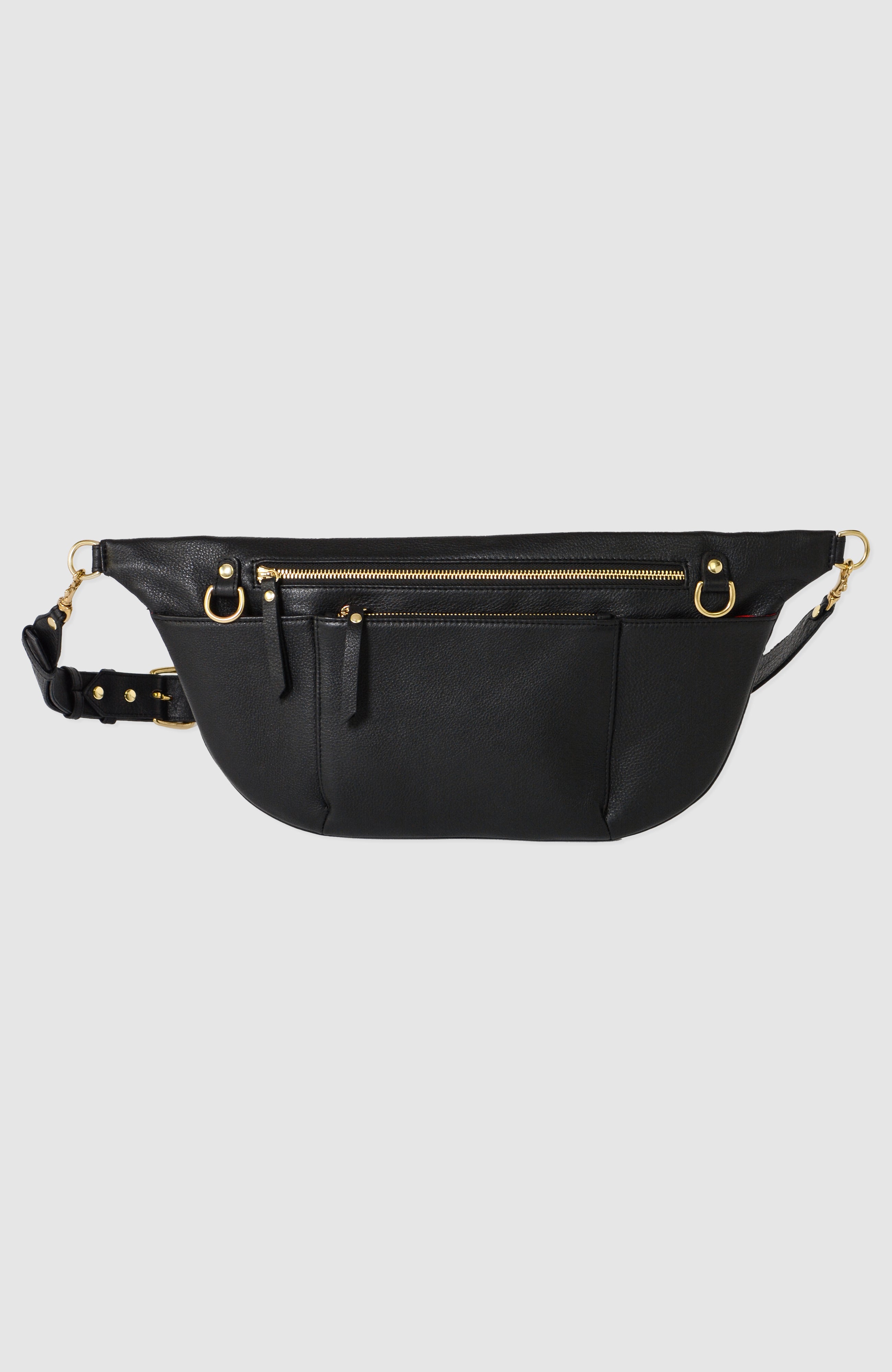 The TAH Commuter Fanny Pack in full-grain leather with solid brass hardware, three exterior zipper pockets, adjustable strap, and fully lined interior. Perfect for travel and everyday use.