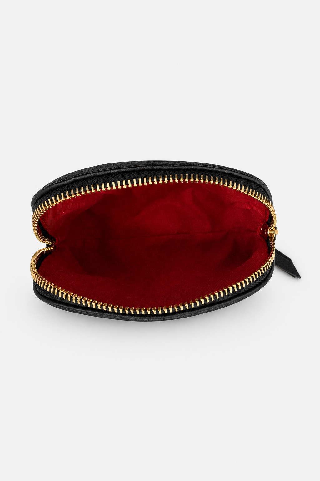 A small zippered pouch with a black exterior, gold-tone zipper, and a deep red interior, shown open against a light gray background.