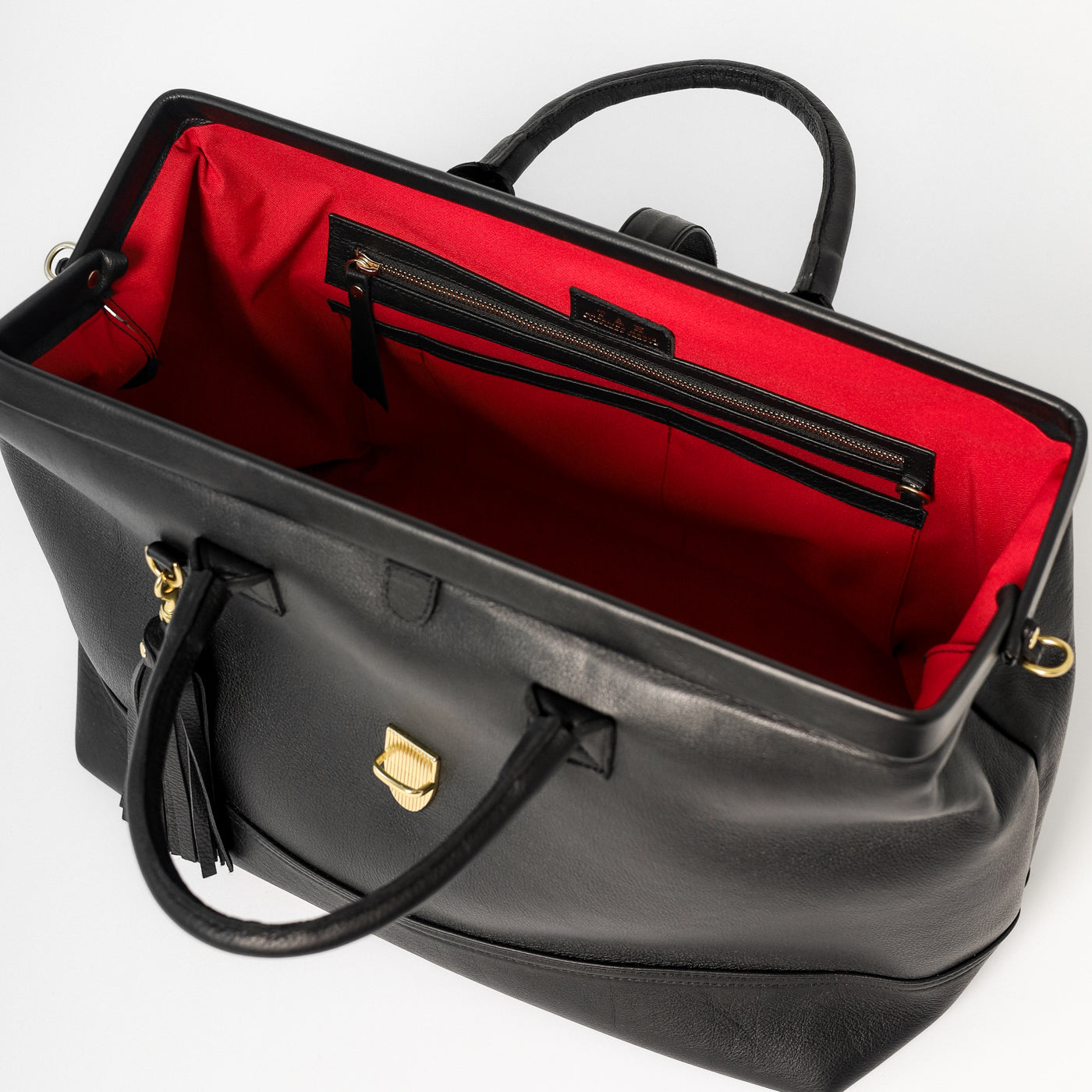 Doctor Weekender Top Handle Bag Black Leather Interior View with red lining 