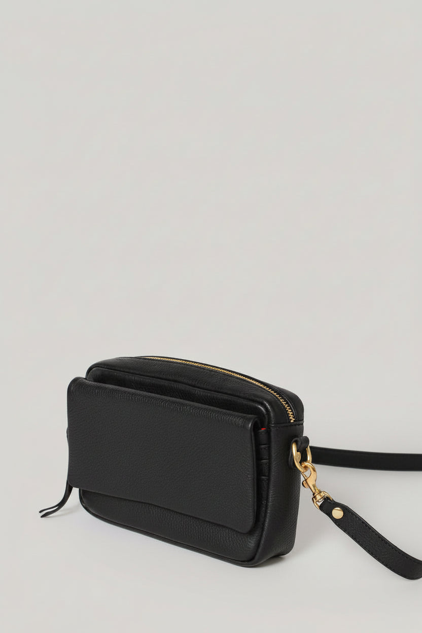 Handcrafted leather crossbody with built in wallet and exterior pocket for your smart phone. 