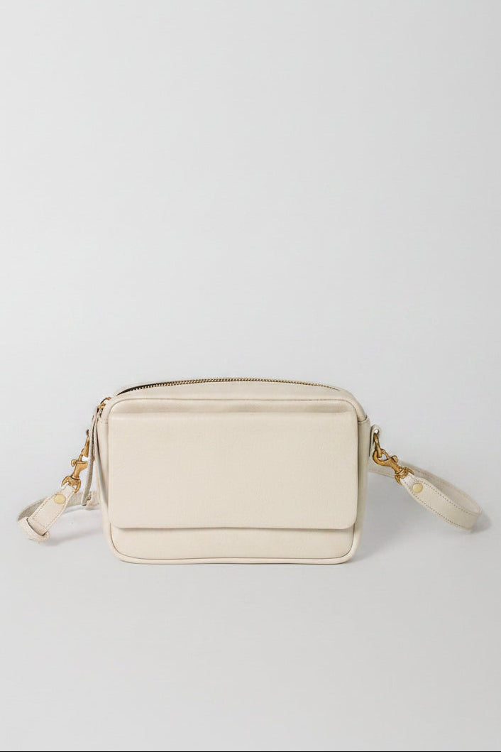 A ivory leather bag with a wallet feature and crossbody strap. 