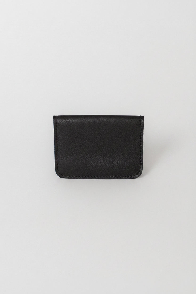 Fold over full grain leather wallet in the color black, a simple sleek design that holds up to 10 credit cards, and some cash