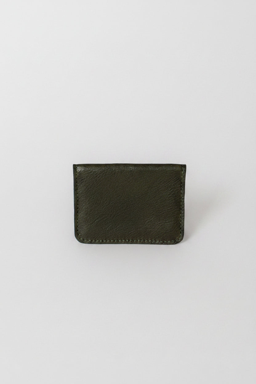 Fold over full grain leather wallet in the color forest green, a simple sleek design that holds up to 10 credit cards, and some cash