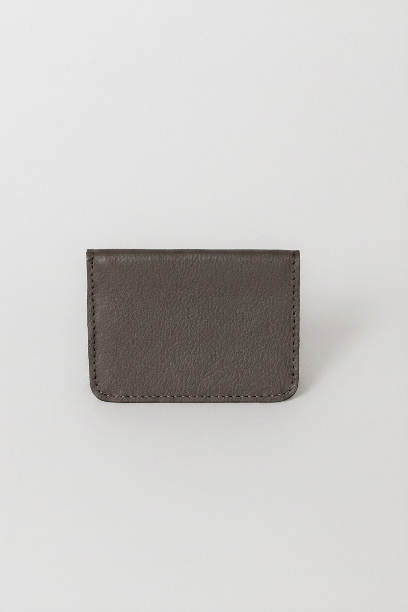 Fold over full grain leather wallet in the color grey, a simple sleek design that holds up to 10 credit cards, and some cash