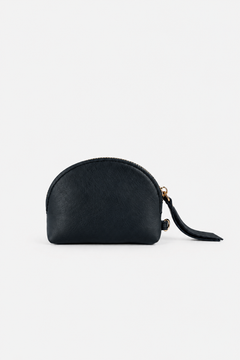 A small black leather zip pouch with a semi-circular dome shape and a matching leather tassel zipper pull, shown on a plain light gray background. This is the Half Moon Coin Purse.