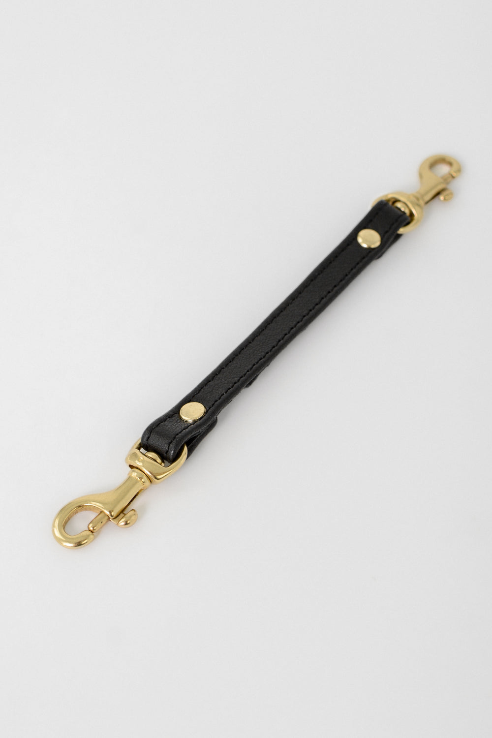 Black leather strap with gold hardware 