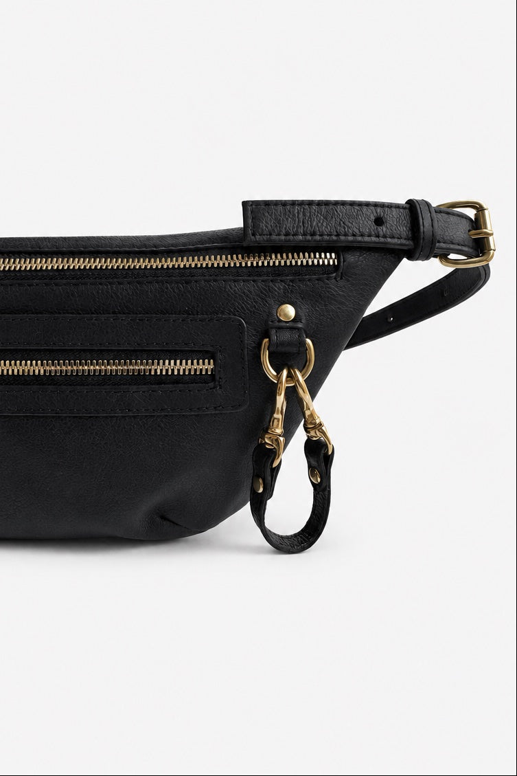 A black leather belt bag with gold-tone zippers and hardware, shown against a plain white background.