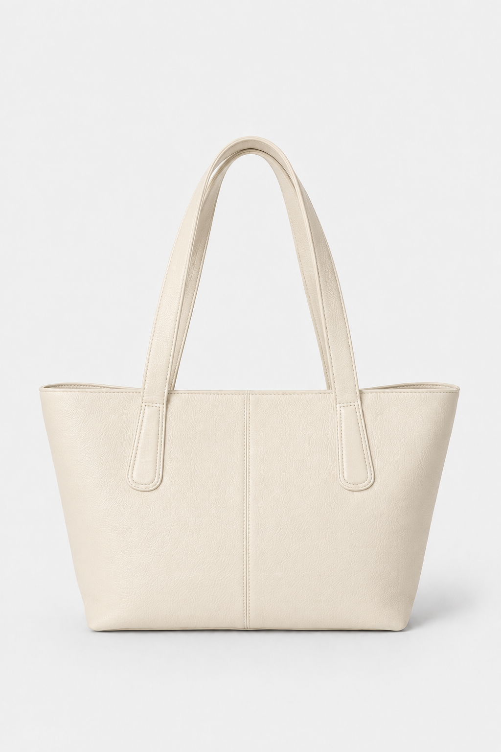 A light beige full-grain leather tote bag with two shoulder straps, shown against a plain light gray background. This is the Megan Everyday Tote Bag in the color Bone.