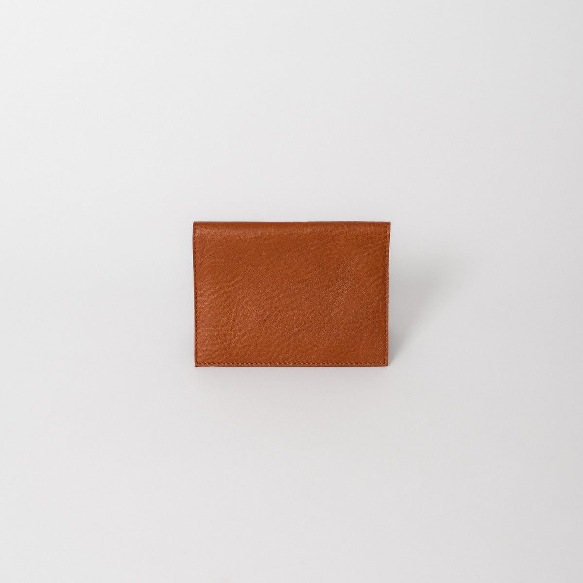 A brown leather passport wallet 