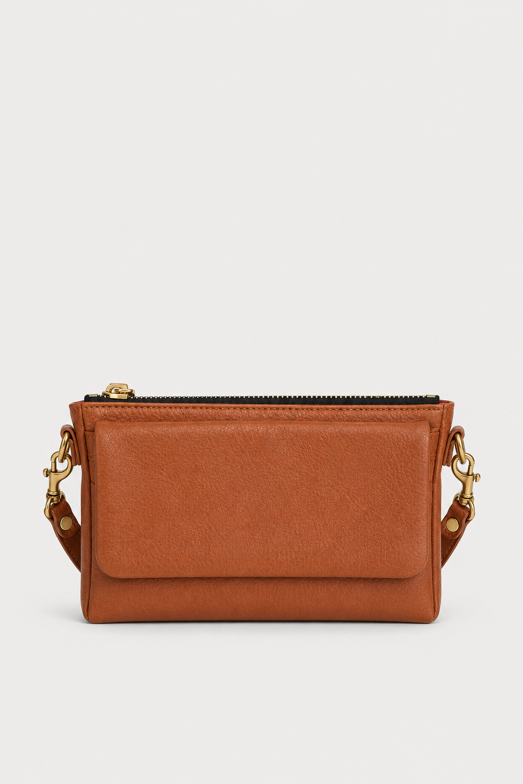 A small brown leather crossbody bag with a top zipper, a front flap pocket, and gold-tone chain strap details, shown against a light gray background.