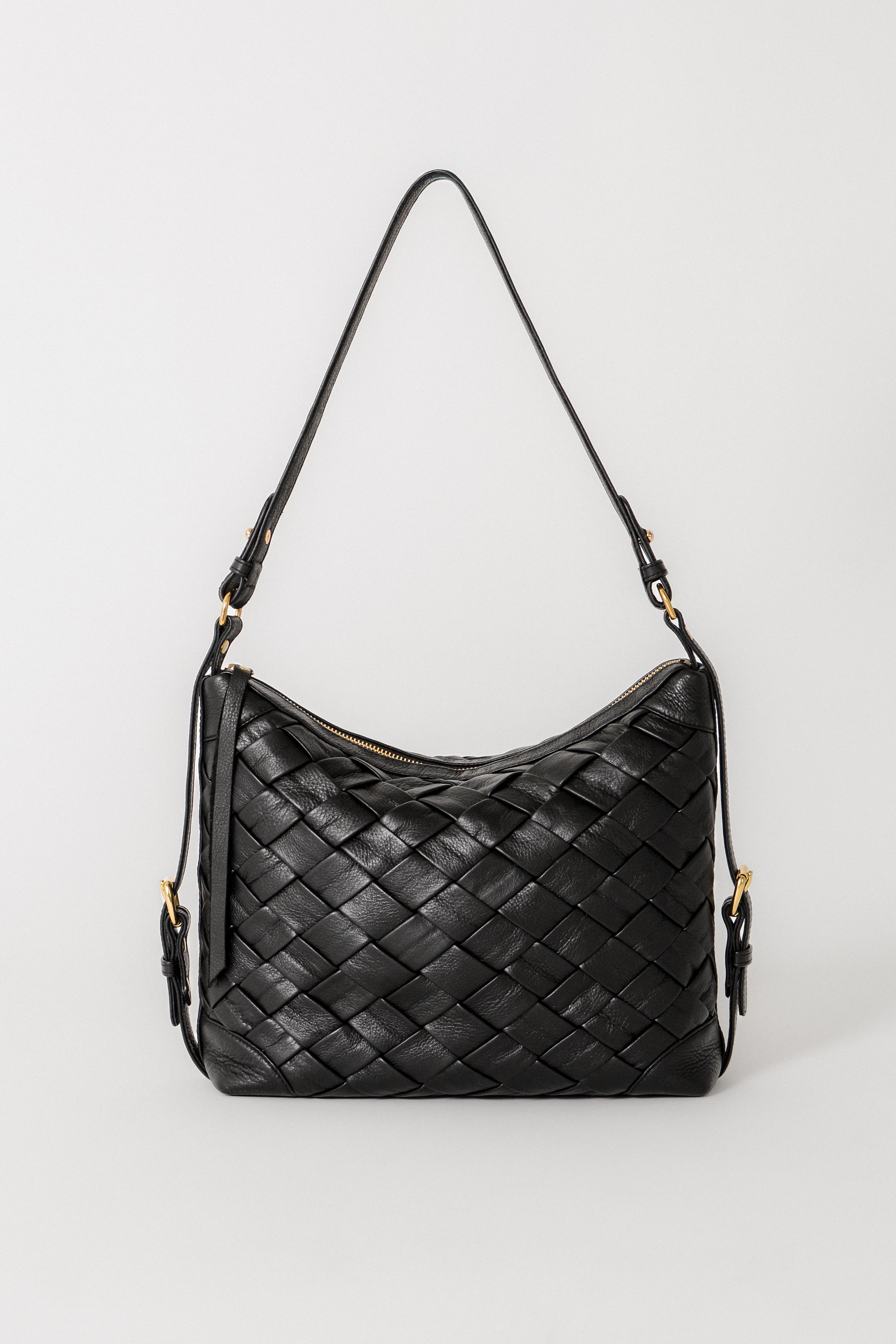This is a Designer Black leather Selena Handwoven bag featuring intricate woven construction, handcrafted using a wooden mold, designed as a refined shoulder bag.